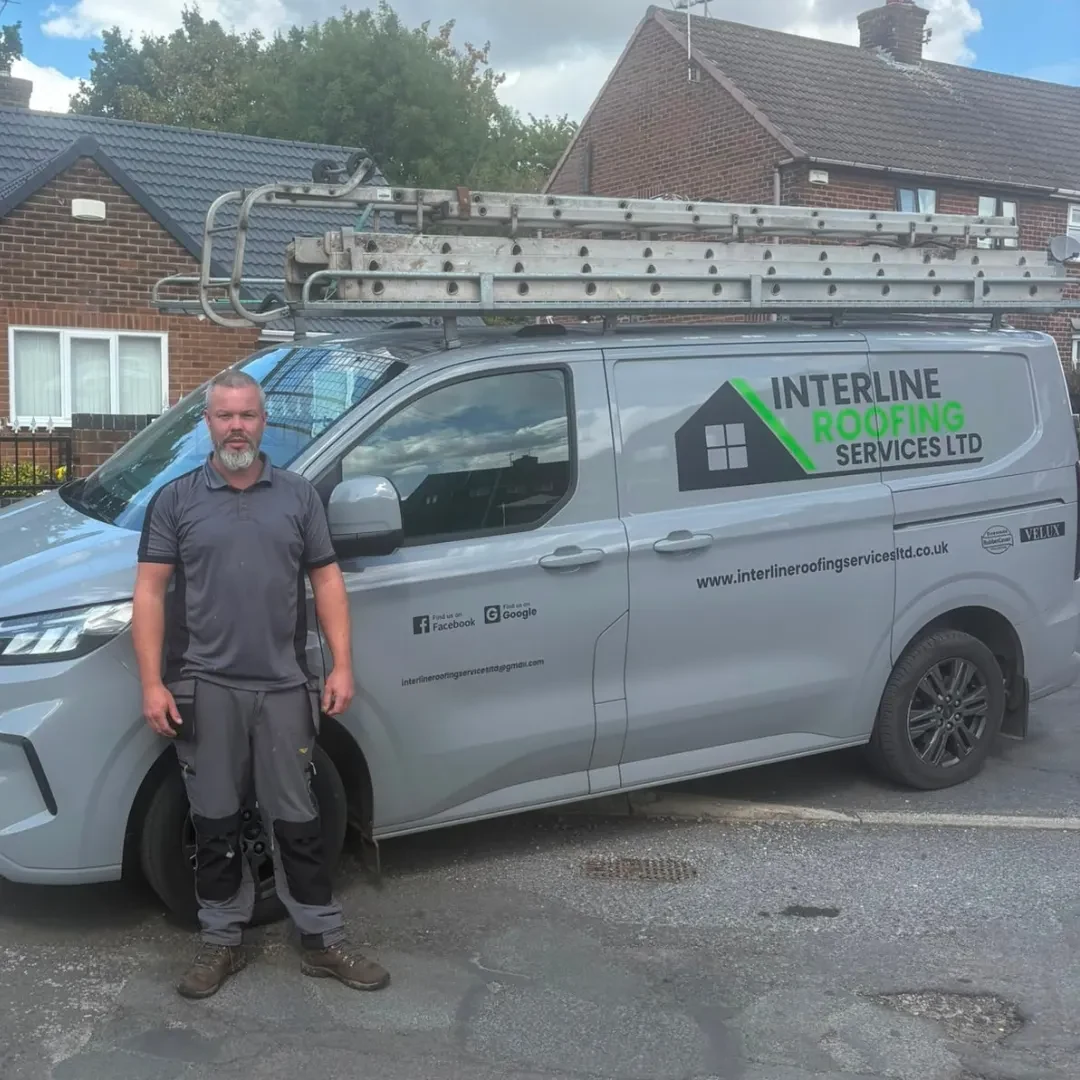 Leeroy Lee, founder of Interline Roofing, with the company van